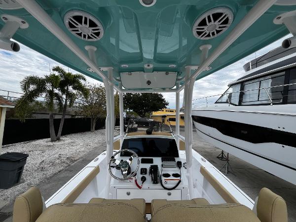 Slide: The Image of 2024 Sportsman Masters 227 Bay Boat interior with helm and seating. - 11