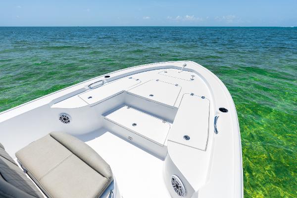 Slide: The Image of 2024 Sportsman Masters 247 Bay Boat on clear green waters. - 1