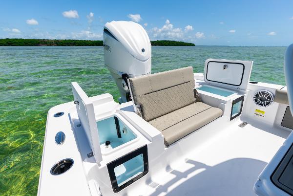 Slide: The Image of 2024 Sportsman Masters 247 Bay Boat with seating and storage compartments. - 12
