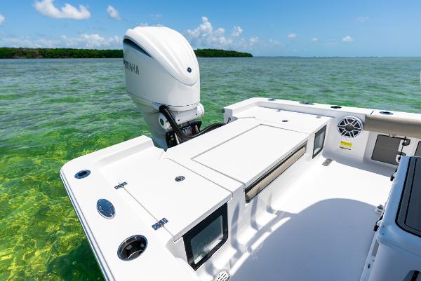 Slide: The Image of 2024 Sportsman Masters 247 Bay Boat on clear water. - 15
