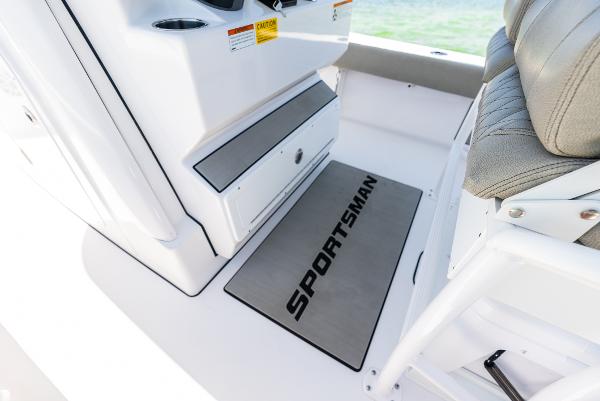 Slide: The Image of 2024 Sportsman Masters 247 Bay Boat interior with branded mat and seating. - 21