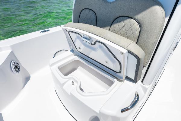 Slide: The Image of 2024 Sportsman Masters 247 Bay Boat with open storage compartment. - 6
