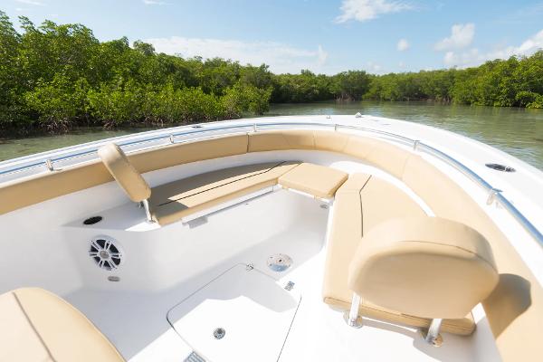 Slide: The Image of Manufacturer Provided Image: 2025 Sportsman Open 232 Center Console boat with tan seating in a scenic waterway. - 4
