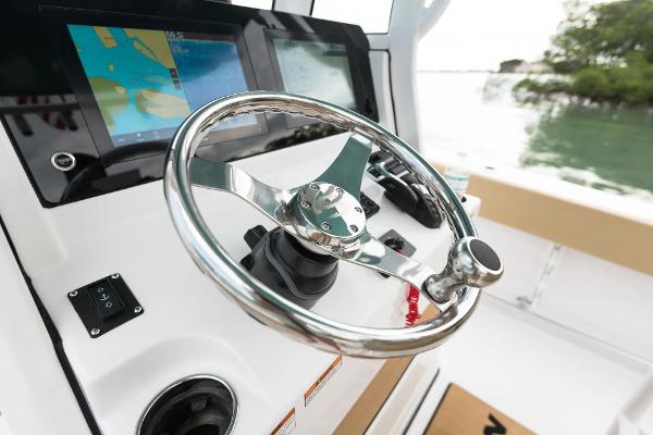 Slide: The Image of Manufacturer Provided Image: 2025 Sportsman Open 232 Center Console steering wheel and navigation display. - 7