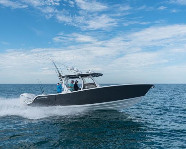 Slide: The Image of 2024 Sportsman Open 322 boat cruising on open water. - 1