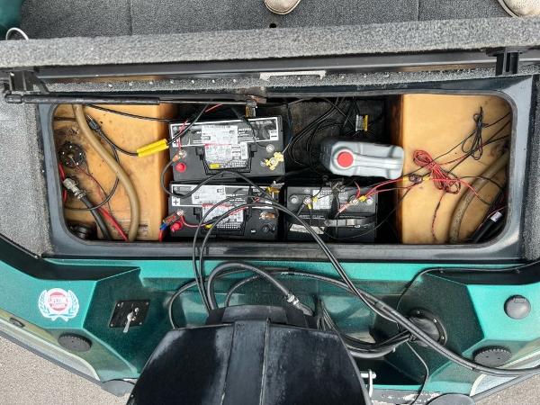 Slide: The Image of Battery compartment of a 1999 Sprint 286 Pro boat with wiring and components. - 1