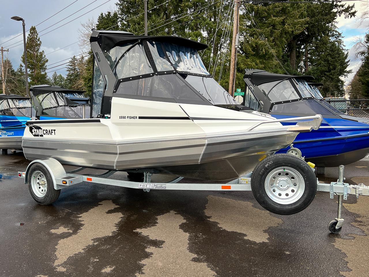 Slide: The Image of 2024 Stabicraft 1550 Fisher boat on trailer, displayed outdoors. - 1