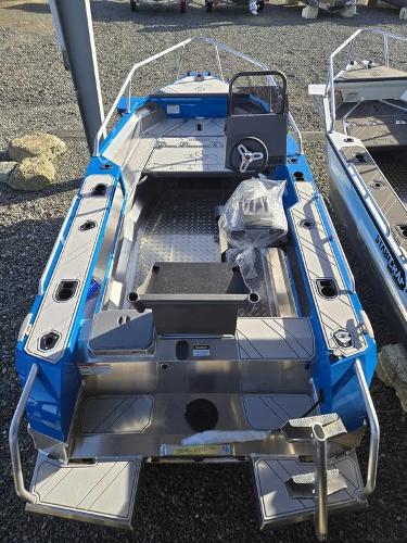 Slide: The Image of 2024 Stabicraft 1550 Frontier boat, blue exterior, spacious deck, and modern design. - 2