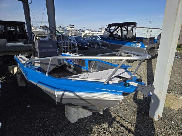 Slide: The Image of 2024 Stabicraft 1550 Frontier boat on display at a marina. - 4