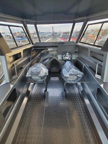 Slide: The Image of 2024 Stabicraft 1850 Supercab Adventure interior with dual seats and panoramic windows. - 1