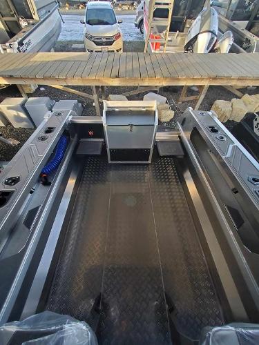 Slide: The Image of 2024 Stabicraft 1850 Supercab Adventure boat interior with diamond plate flooring. - 2