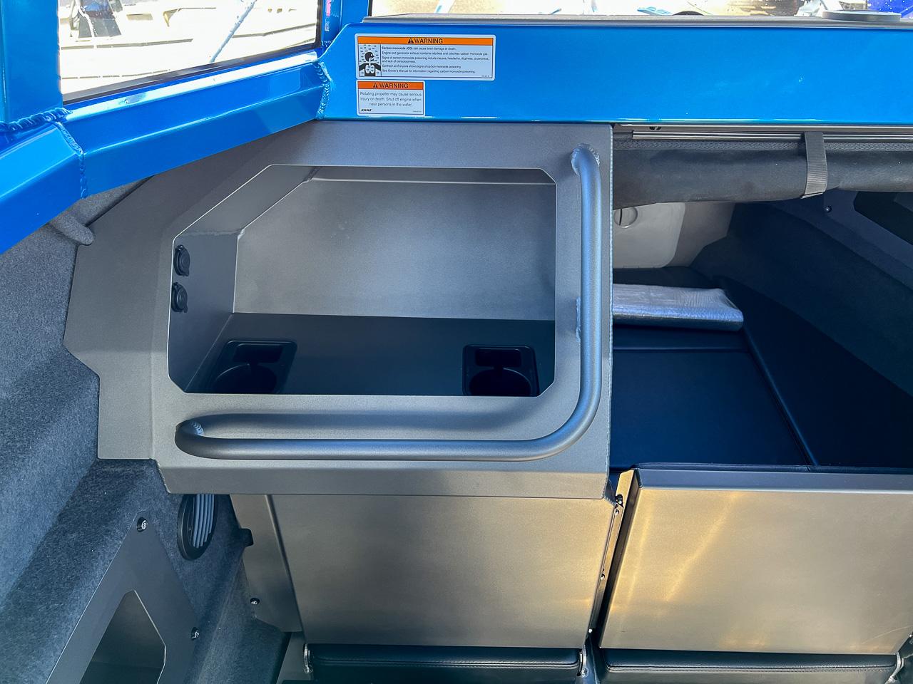 Slide: The Image of Interior of 2023 Stabicraft 2500 Ultracab XL, featuring storage compartments and cup holders. - 10