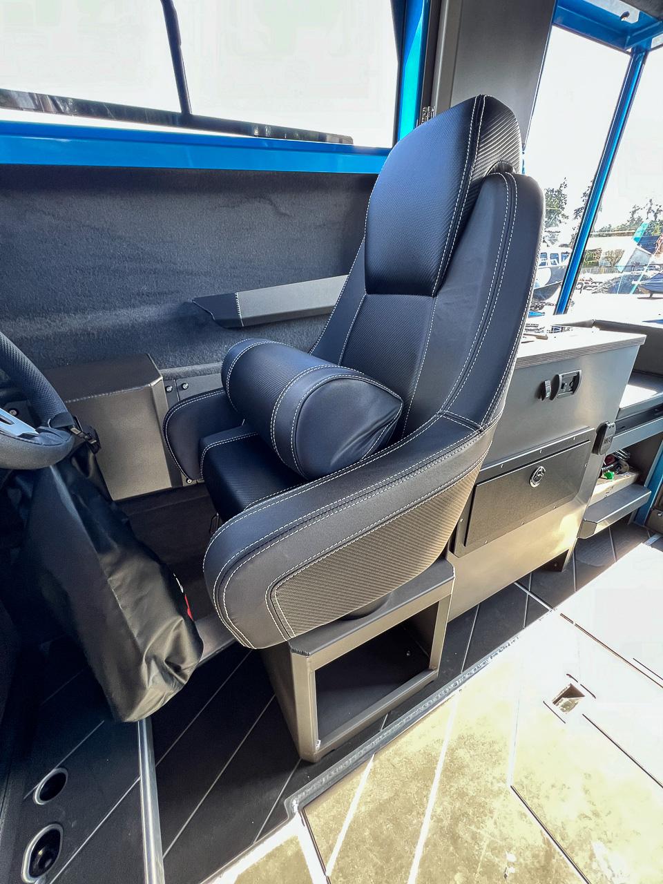 Slide: The Image of Captain's seat in 2023 Stabicraft 2500 Ultracab XL boat interior. - 12