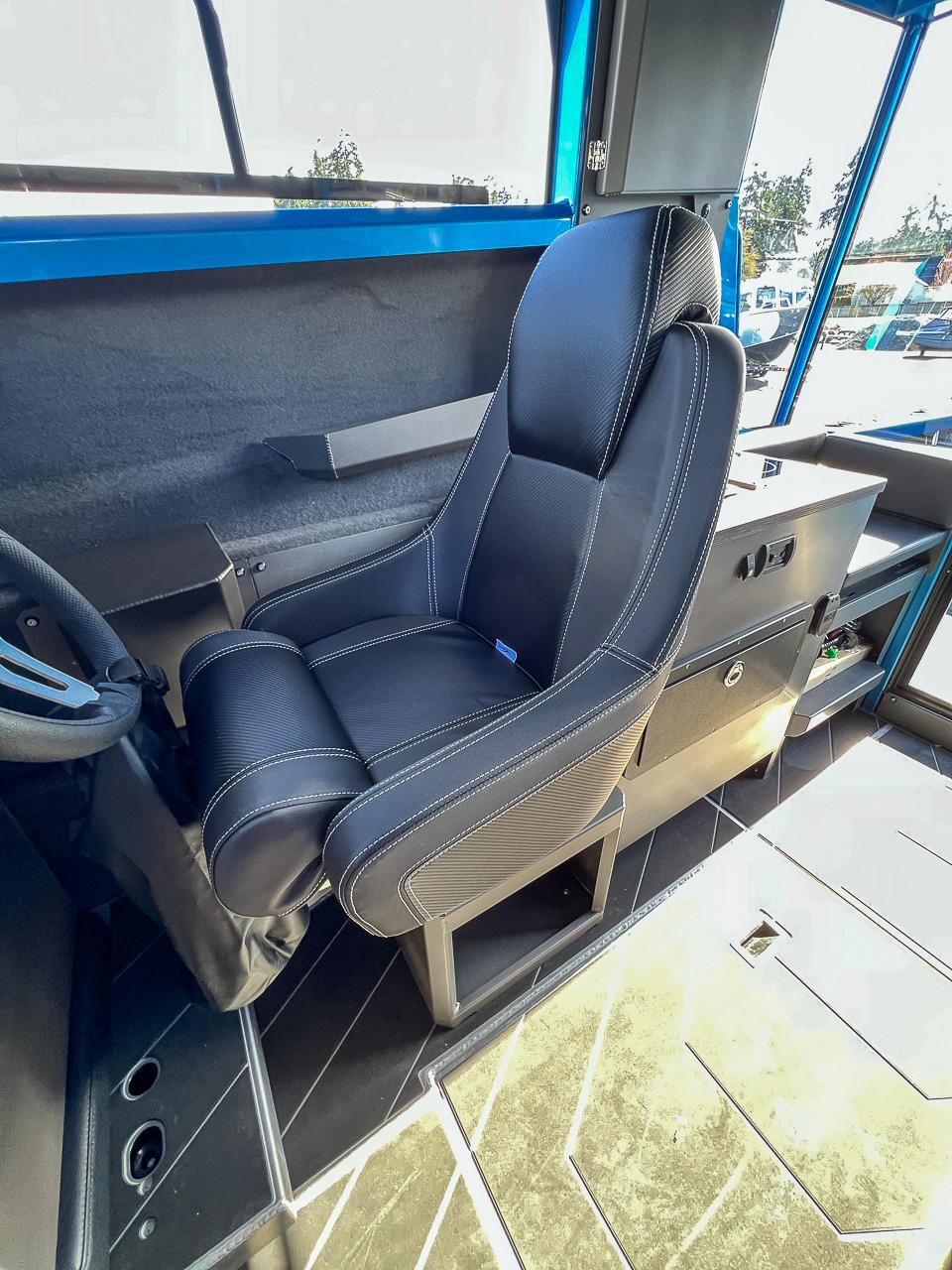 Slide: The Image of Captain's seat in 2023 Stabicraft 2500 Ultracab XL boat interior. - 13