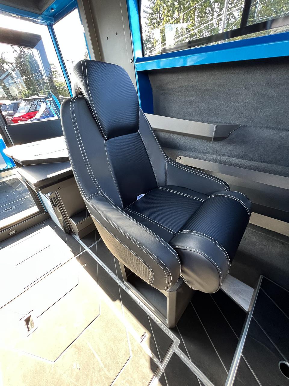 Slide: The Image of Captain's chair inside 2023 Stabicraft 2500 Ultracab XL boat. - 14