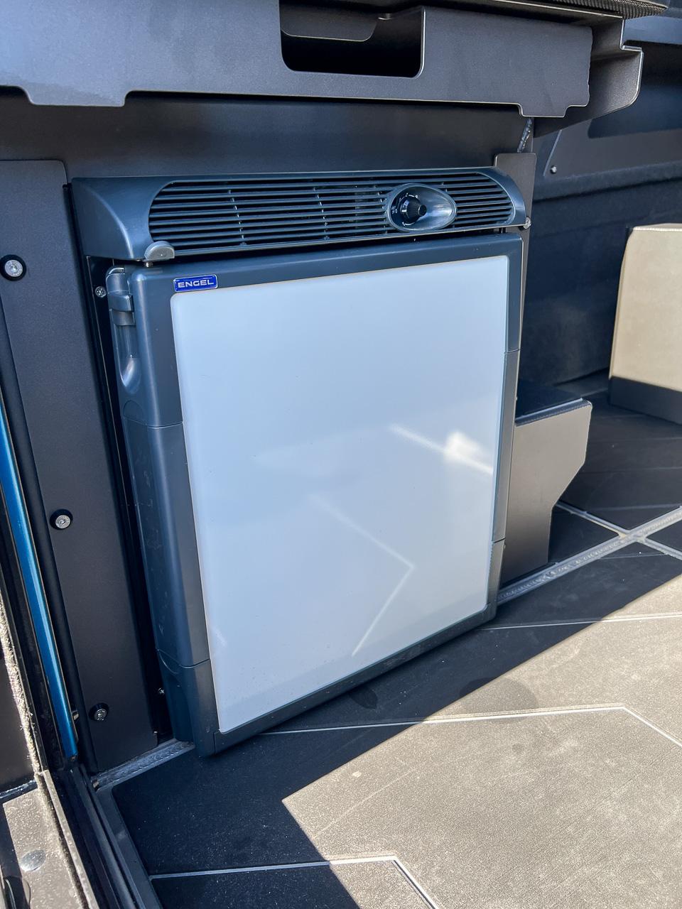 Slide: The Image of Compact refrigerator in 2023 Stabicraft 2500 Ultracab XL boat interior. - 19