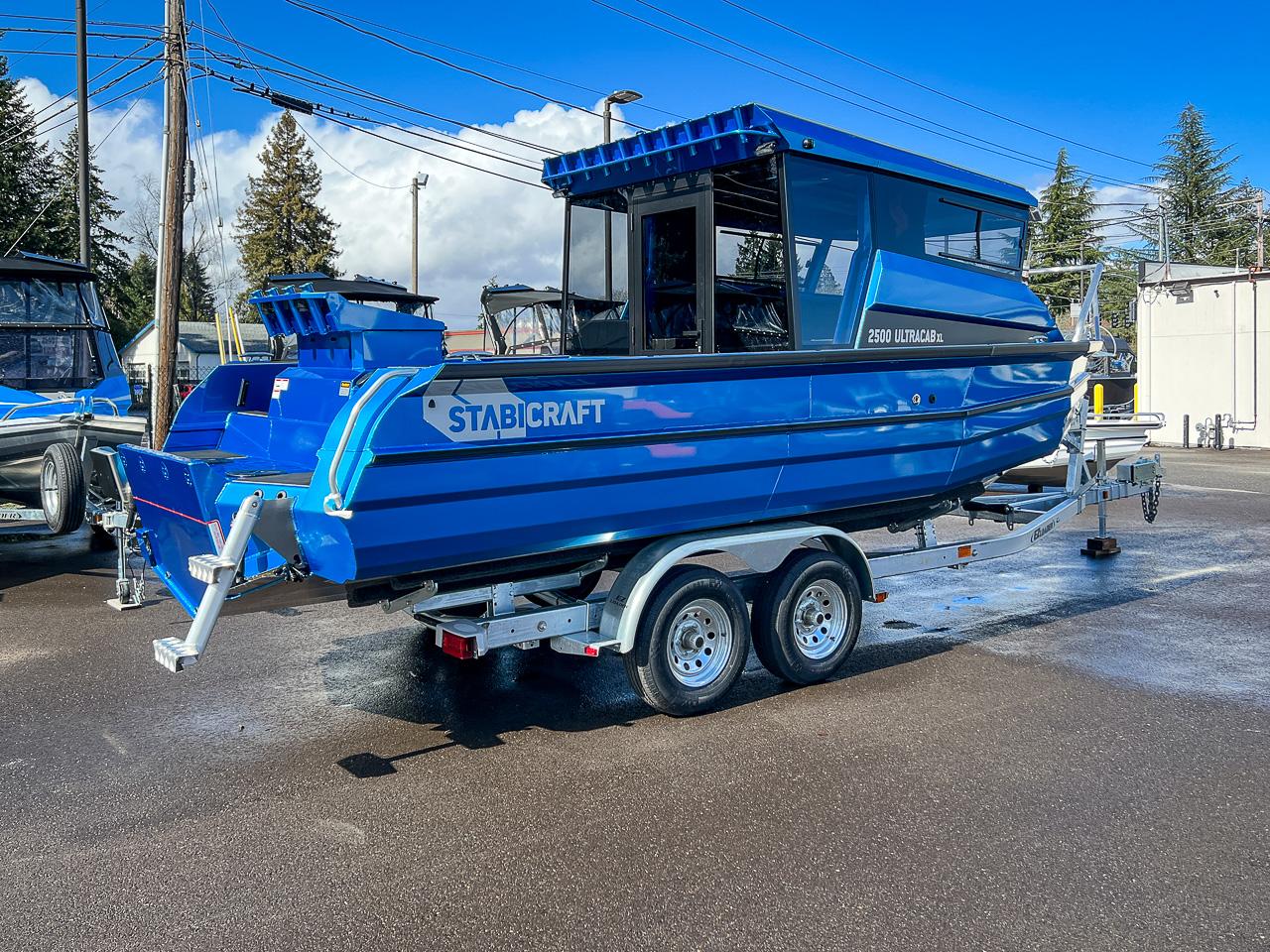 Slide: The Image of 2023 Stabicraft 2500 Ultracab XL boat on a trailer in a parking lot. - 3