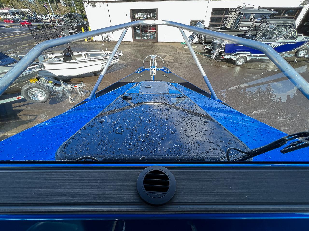 Slide: The Image of View from the bow of a 2023 Stabicraft 2500 Ultracab XL boat in a dealership. - 8