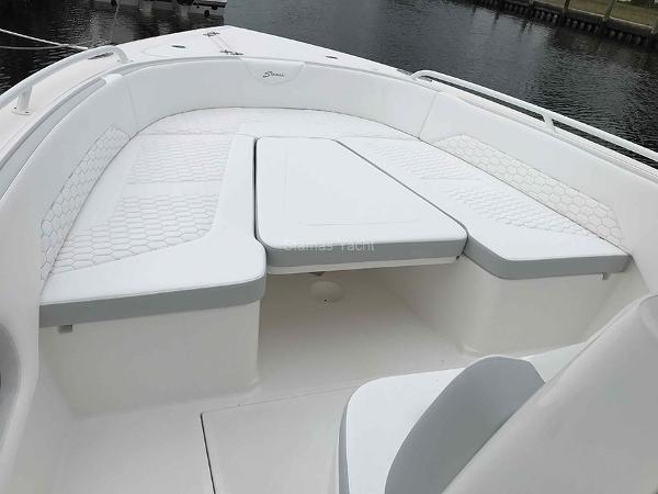 Slide: The Image of 2023 Stamas 31T Aventura boat with white cushioned seating on deck. - 5