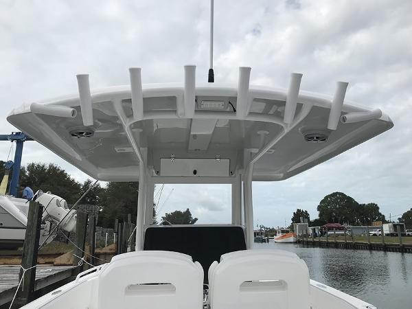 Slide: The Image of 2023 Stamas 31T Aventura boat with T-top, docked by a canal. - 6