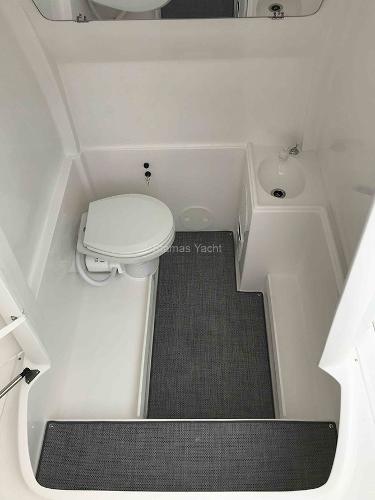 Slide: The Image of 2023 Stamas 31T Aventura boat bathroom with toilet and sink. - 7