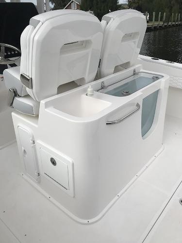 Slide: The Image of 2023 Stamas 31T Aventura boat interior with dual seats and storage compartment. - 8