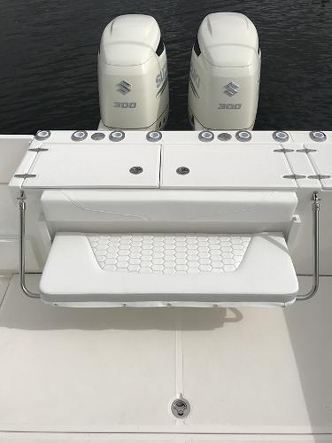 Slide: The Image of 2023 Stamas 31T Aventura boat with dual Suzuki 300 engines, featuring a foldable bench seat. - 9