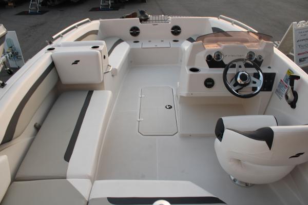 Slide: The Image of 2024 Starcraft 171 SVX boat interior with seating and steering console. - 13