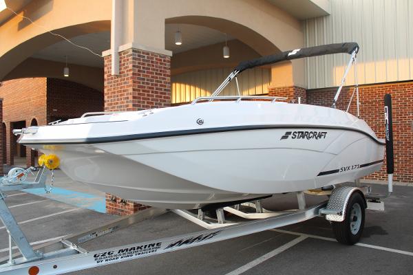 Slide: The Image of 2024 Starcraft 171 SVX boat on a trailer in a parking lot. - 3