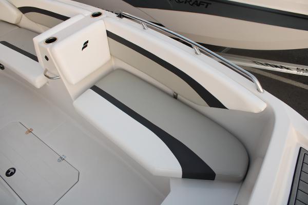 Slide: The Image of 2024 Starcraft 171 SVX boat interior seating with cup holders and sleek design. - 5