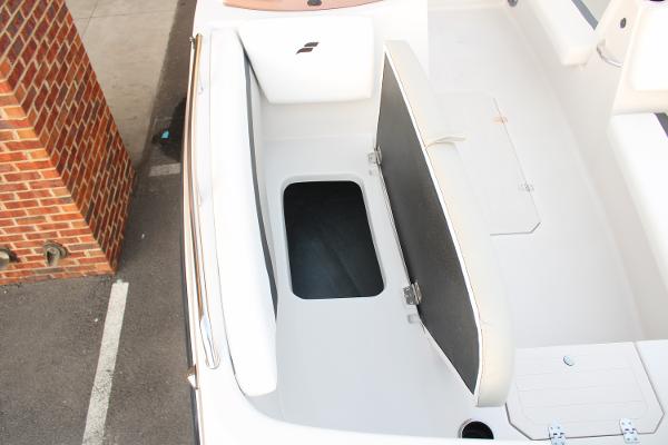 Slide: The Image of 2024 Starcraft 171 SVX boat with open storage compartment. - 9