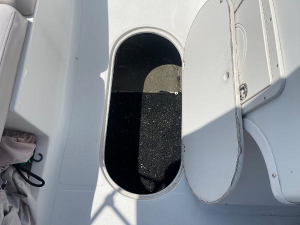 Slide: The Image of Open storage compartment on a 2018 Starcraft 2000 OB Limited boat. - 18
