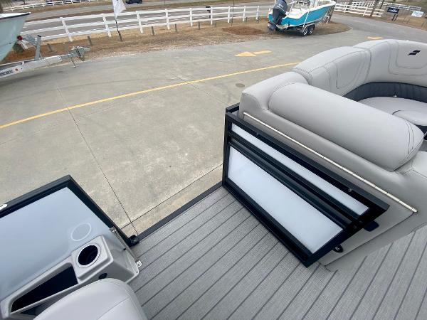 Slide: The Image of 2023 Starcraft SLS 3 pontoon boat interior with open gate and seating. - 11