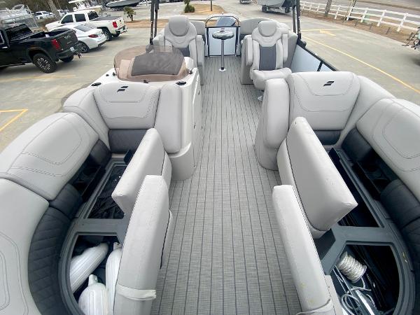 Slide: The Image of 2023 Starcraft SLS 3 pontoon boat with spacious seating and storage compartments. - 20