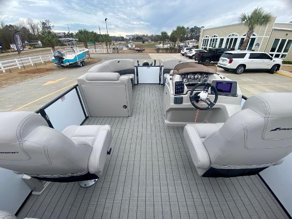 Slide: The Image of 2023 Starcraft SLS 3 pontoon boat interior with modern seating and helm. - 8