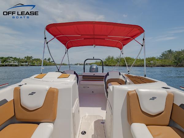 Slide: The Image of 2023 Starcraft SVX 210 OB boat with red canopy on a sunny day. - 7