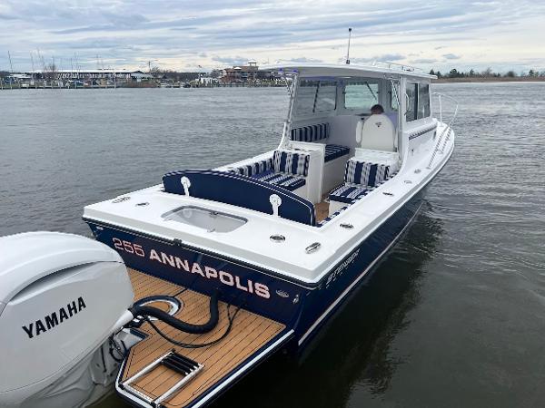 Slide: The Image of 2025 Steiger Craft 255 Annapolis boat with Yamaha engine on calm water. - 10