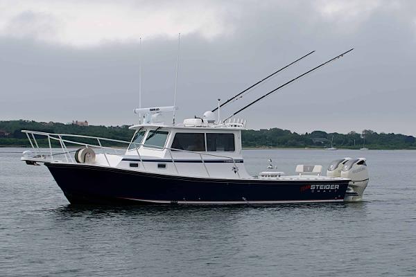 Slide: The Image of 2024 Steiger Craft 31 Miami boat on calm water. - 1