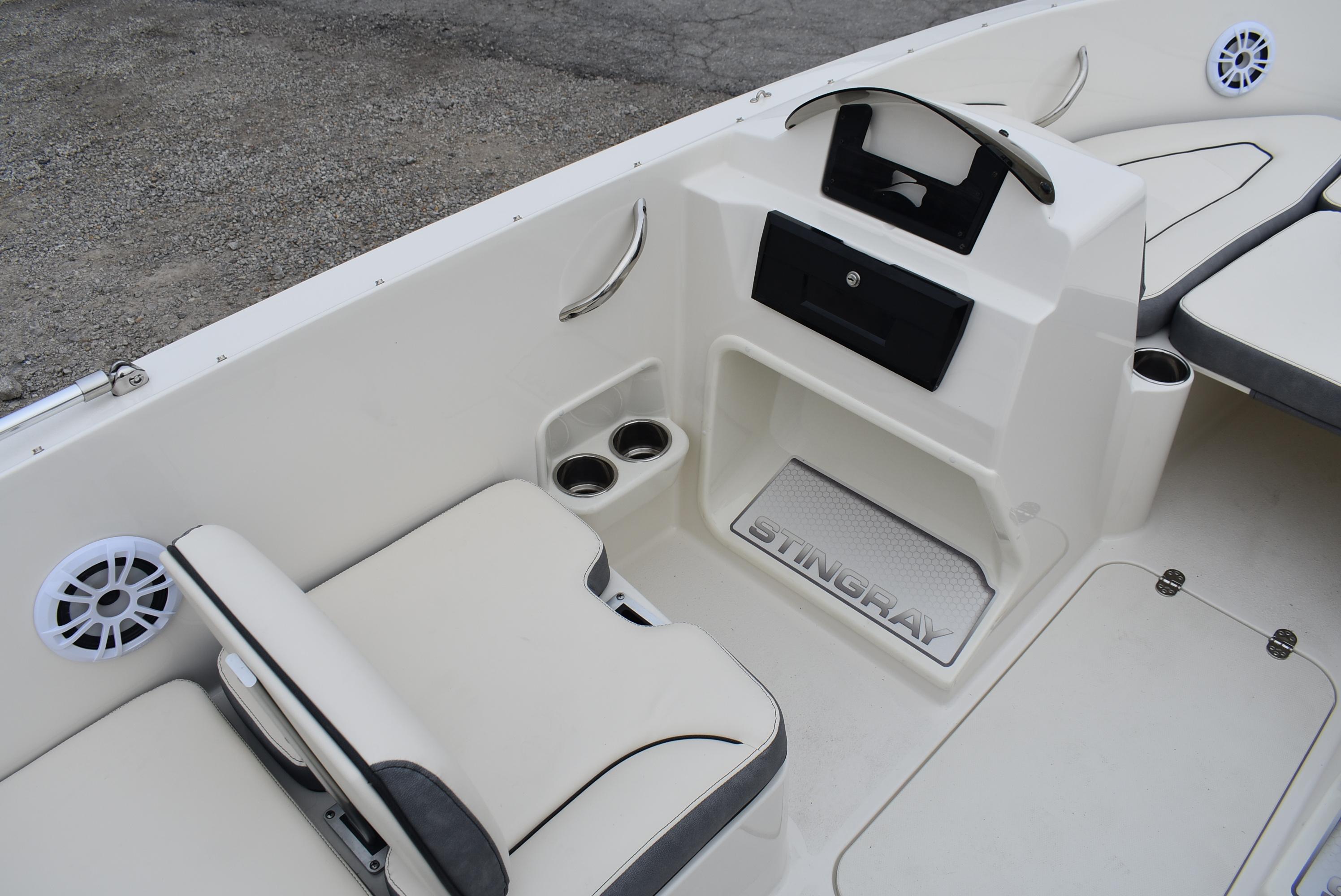 Slide: The Image of 2023 Stingray 172SC boat interior with seating and storage compartments. - 10