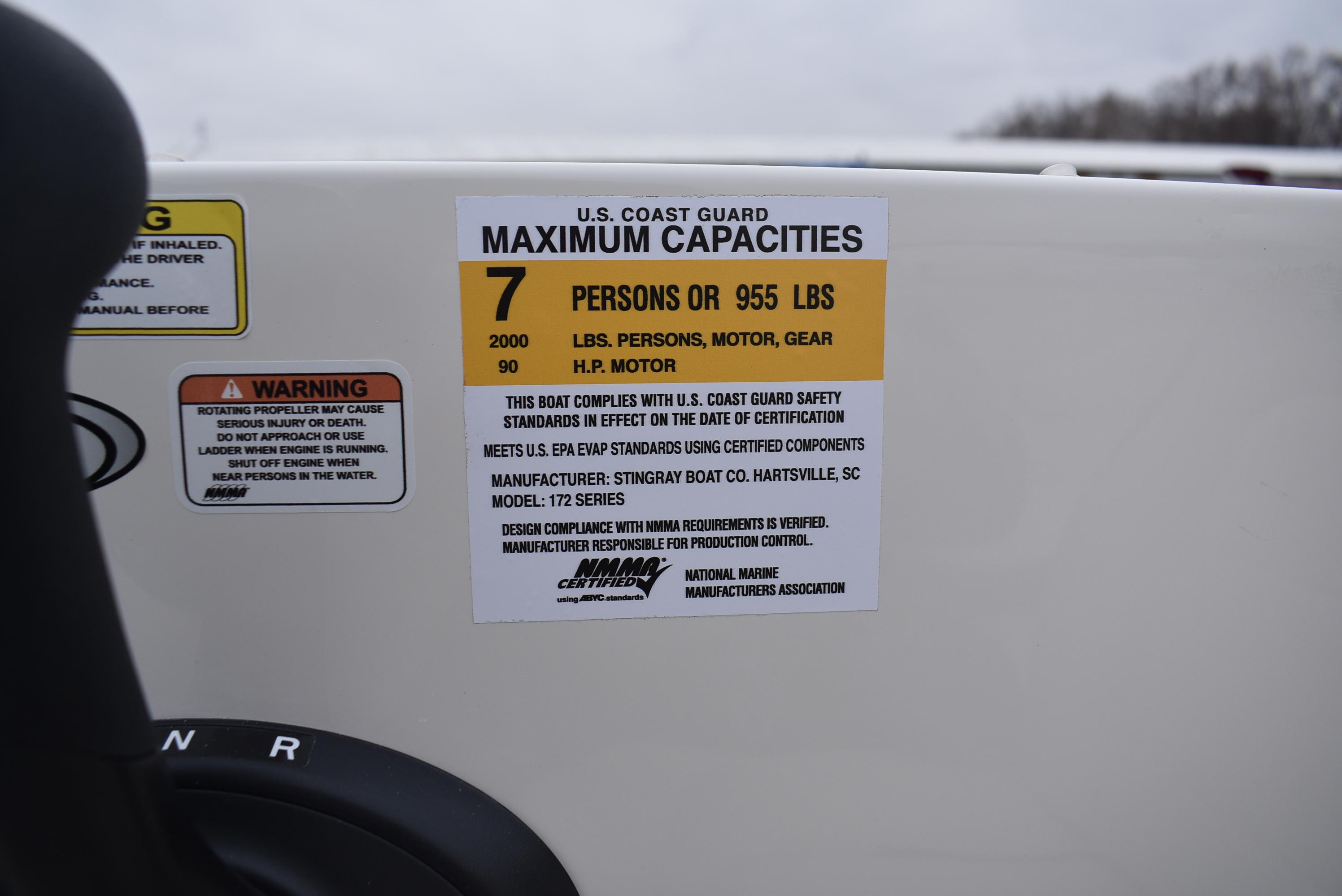 Slide: The Image of U.S. Coast Guard capacity label on 2023 Stingray 172SC boat, maximum 7 persons or 955 lbs. - 11