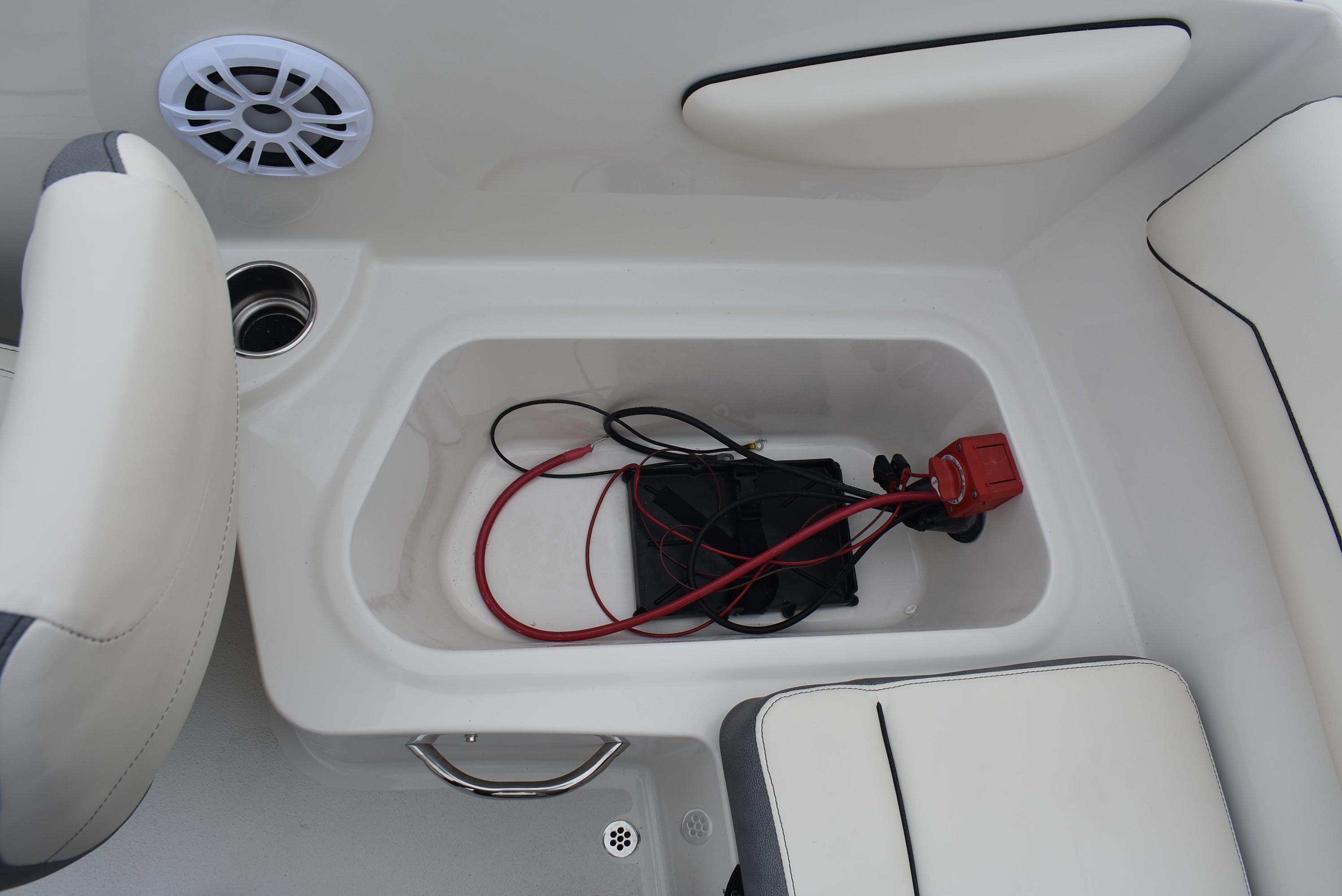 Slide: The Image of 2023 Stingray 172SC boat interior storage compartment with wiring and speaker. - 13