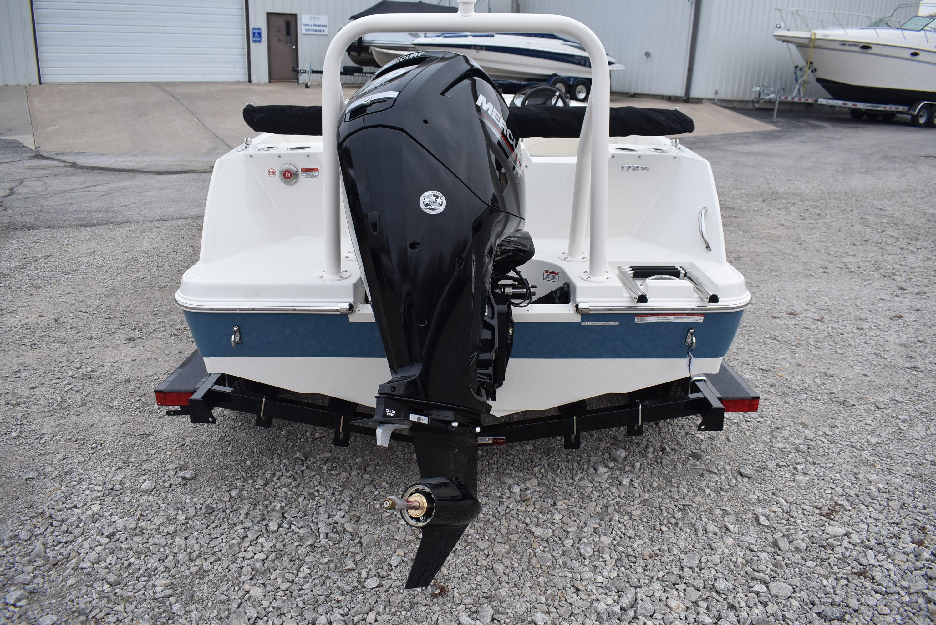 Slide: The Image of 2023 Stingray 172SC boat with outboard motor on a trailer. - 3