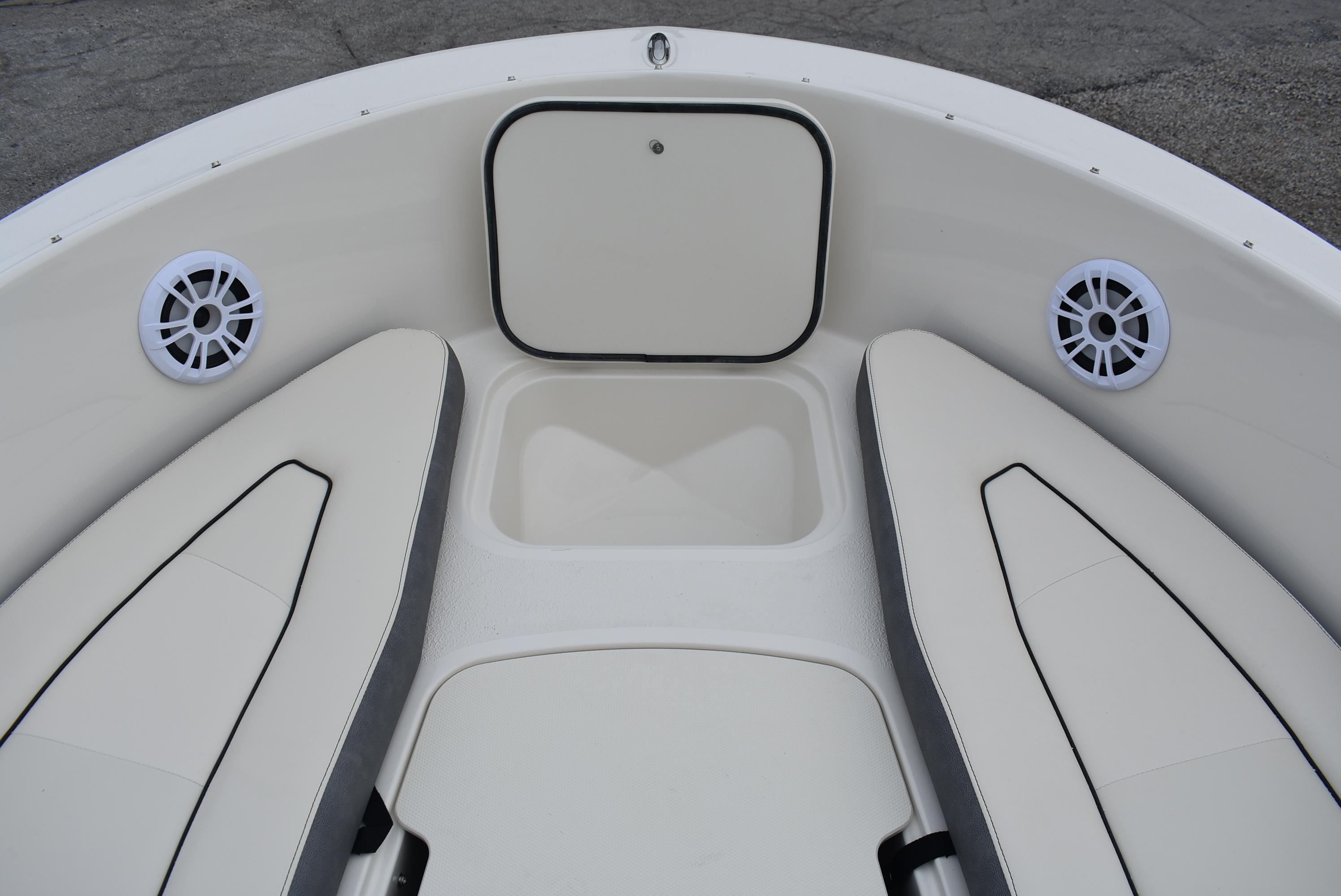 Slide: The Image of 2023 Stingray 172SC boat interior with cushioned seating and speakers. - 7
