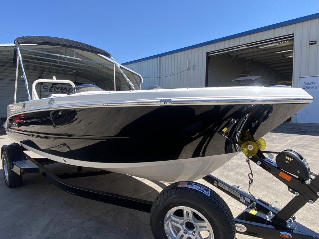 Slide: The Image of 2024 Stingray 172SC boat on trailer outside a warehouse. - 1