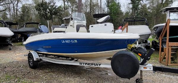 Slide: The Image of 2019 Stingray 186 CC boat on trailer in outdoor setting. - 1