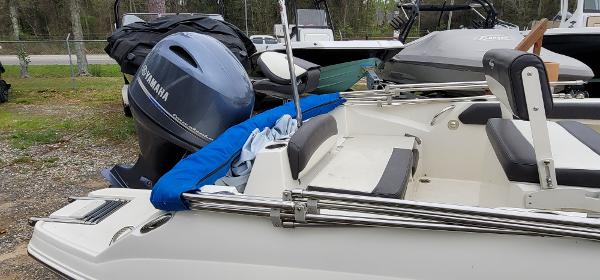 Slide: The Image of 2019 Stingray 186 CC boat with Yamaha outboard motor, parked outdoors. - 10