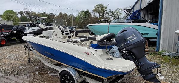 Slide: The Image of 2019 Stingray 186 CC boat with Yamaha engine in a marina setting. - 3