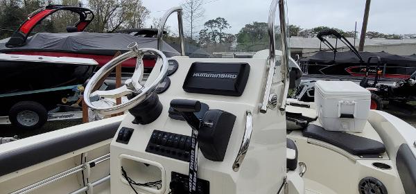 Slide: The Image of 2019 Stingray 186 CC boat dashboard with steering wheel and navigation system. - 5