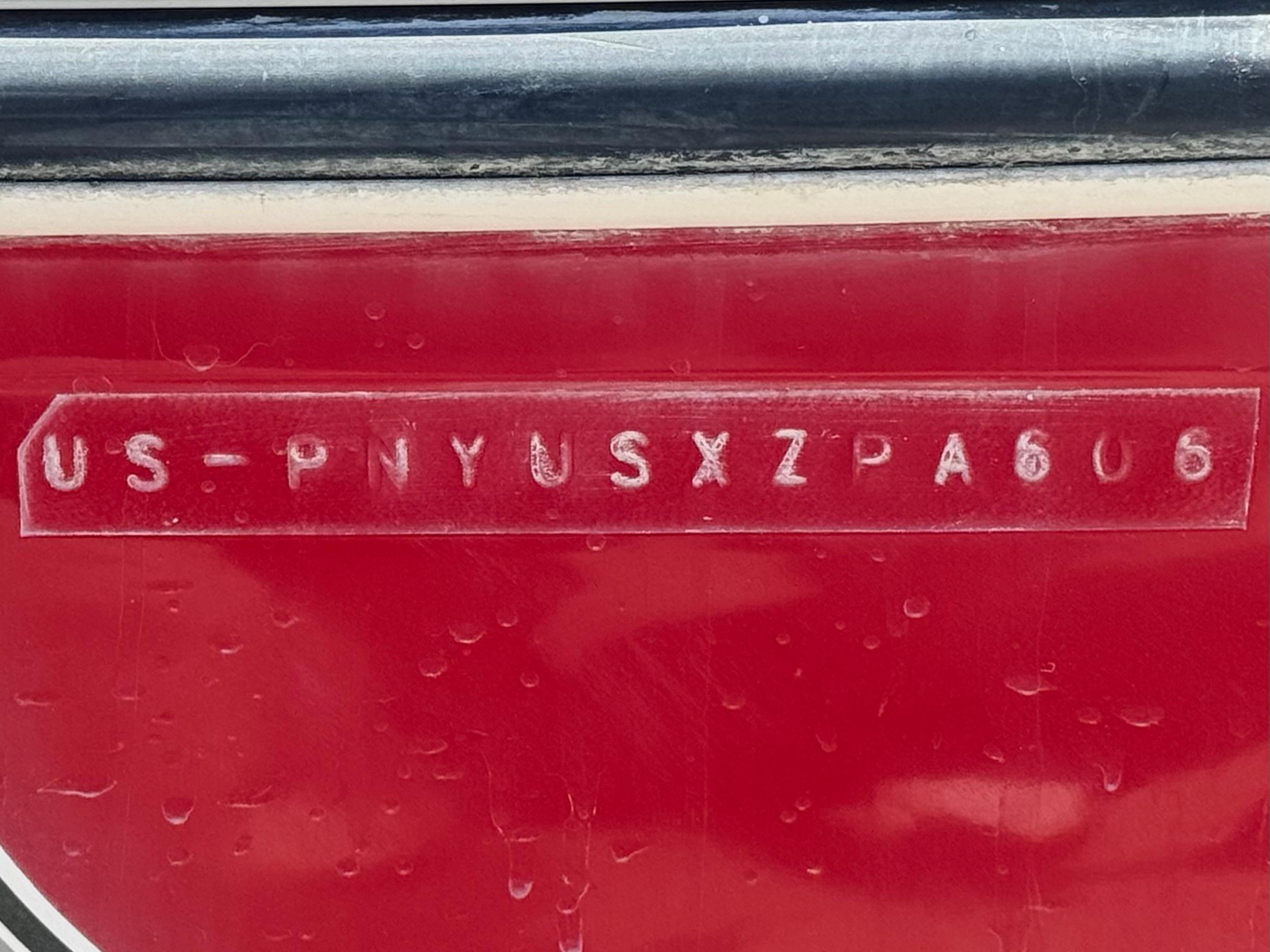 Slide: The Image of VIN on red 2006 Stingray 195 LR boat hull. - 21