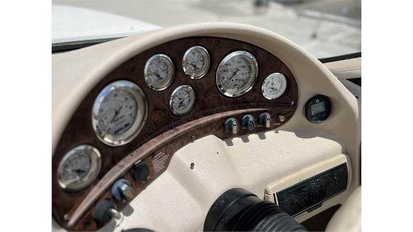Slide: The Image of Dashboard of a 1999 Stingray 200 CS/CX boat with gauges and controls. - 7
